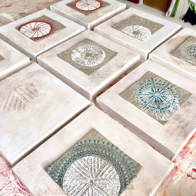 Testing out placent of embroideries on prepared canvases