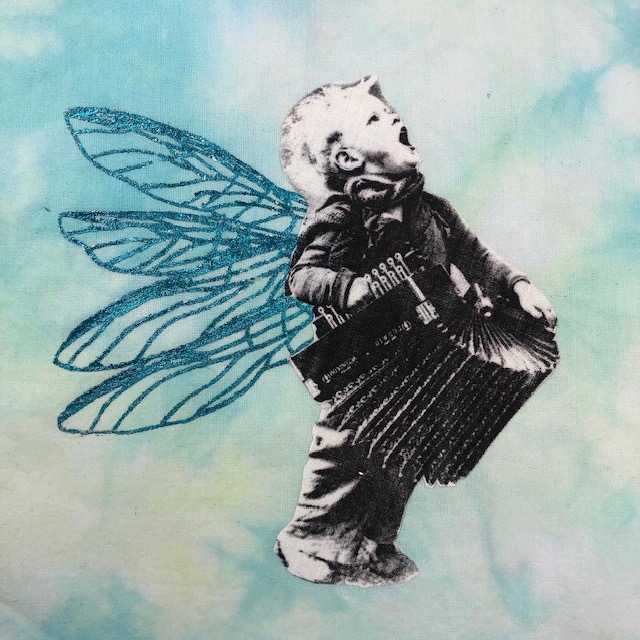 boy playing accordion with dragonfly wings